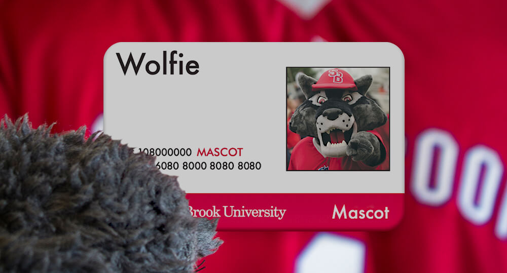 Wolfie holding ID Card