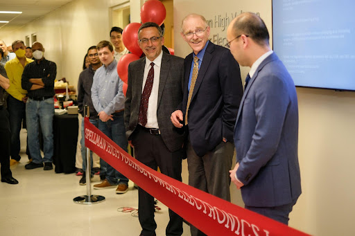Dr. Loren Skeist, President and CEO, Spellman High Voltage Electronics Corp., Petar Djuric and Fang Luo officially open the Spellman Power Electronics Lab]