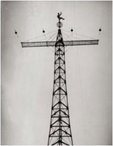 Fearless Armstrong atop RCA’s 115-foot antenna towerwhich stood on the roof of the 21-story Aeolian Hall in Midtown Manhattan