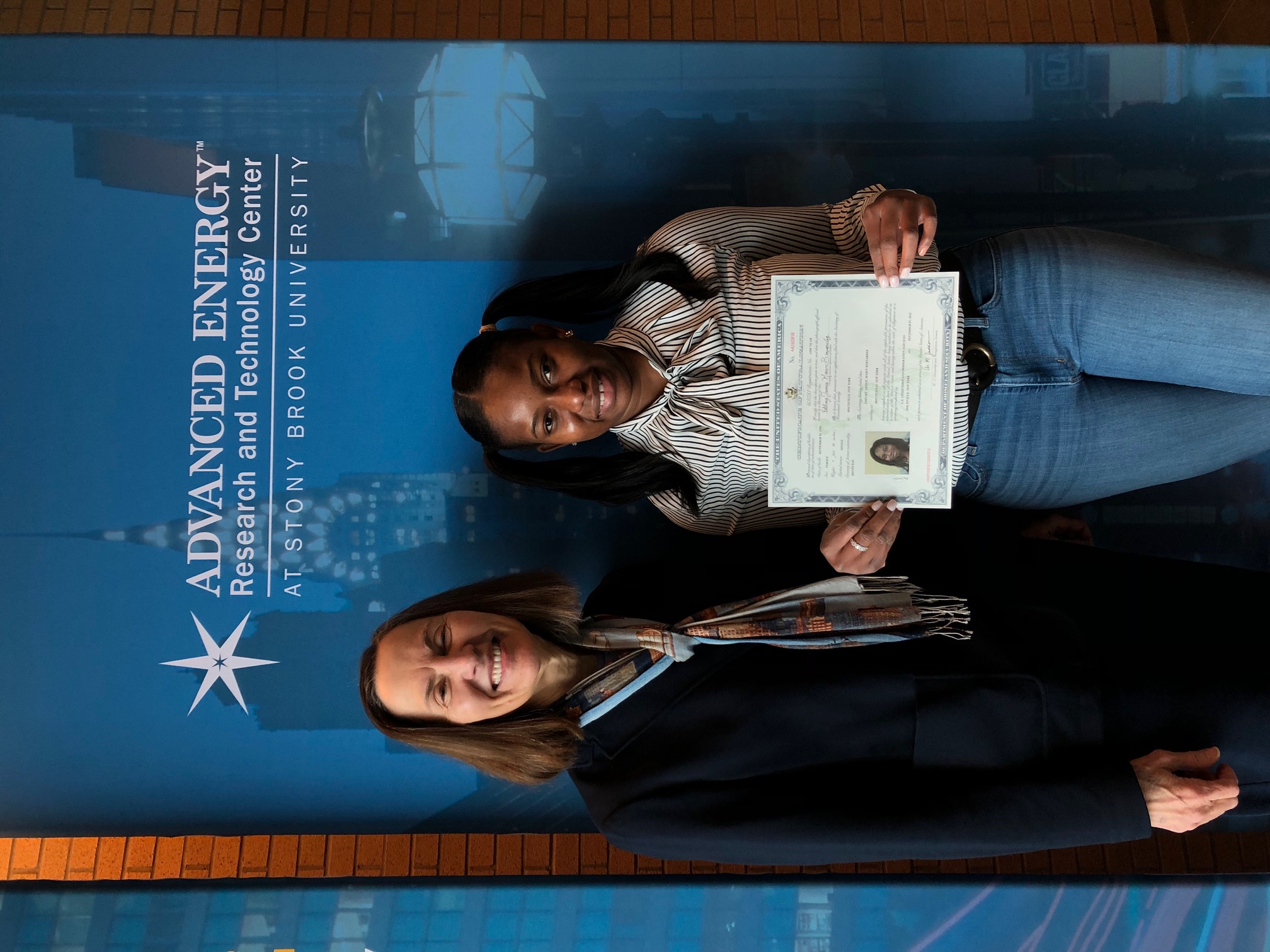 Dr Esther Takeuchi with Edelmy and citizenship certificate